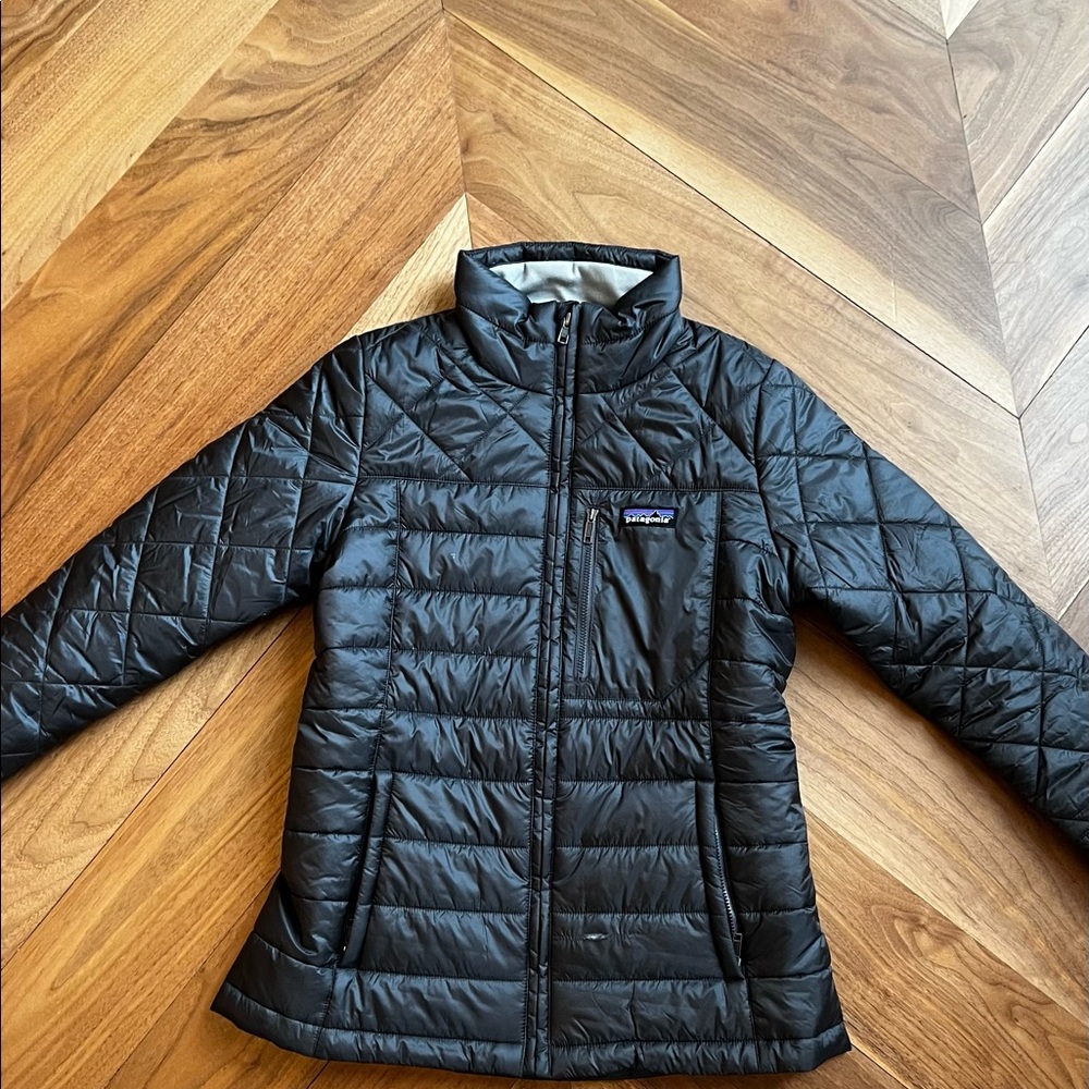 Patagonia jacket. Worn 2 times. Small tear on front pocket